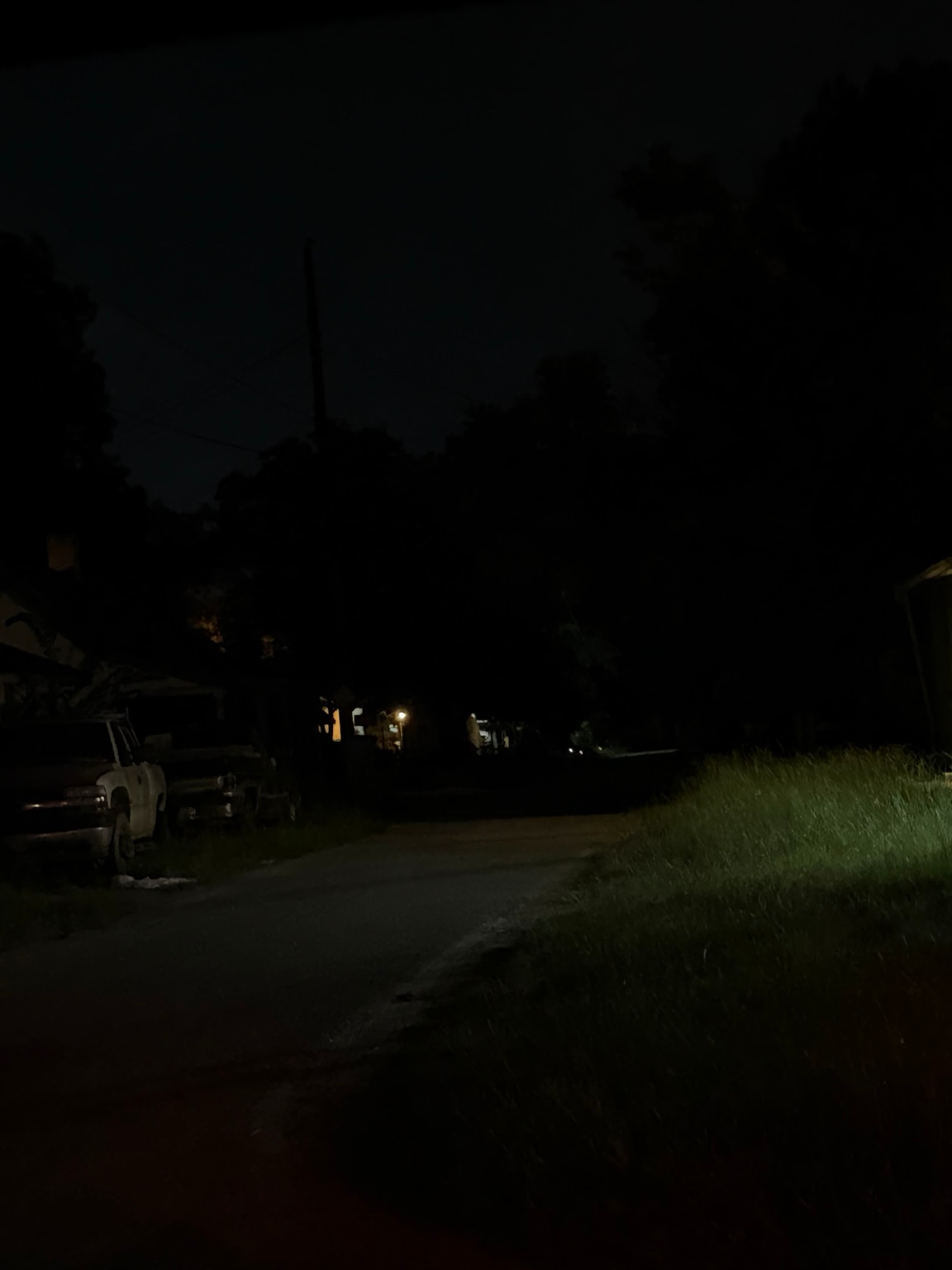 Dark residential street with limited nighttime visibility